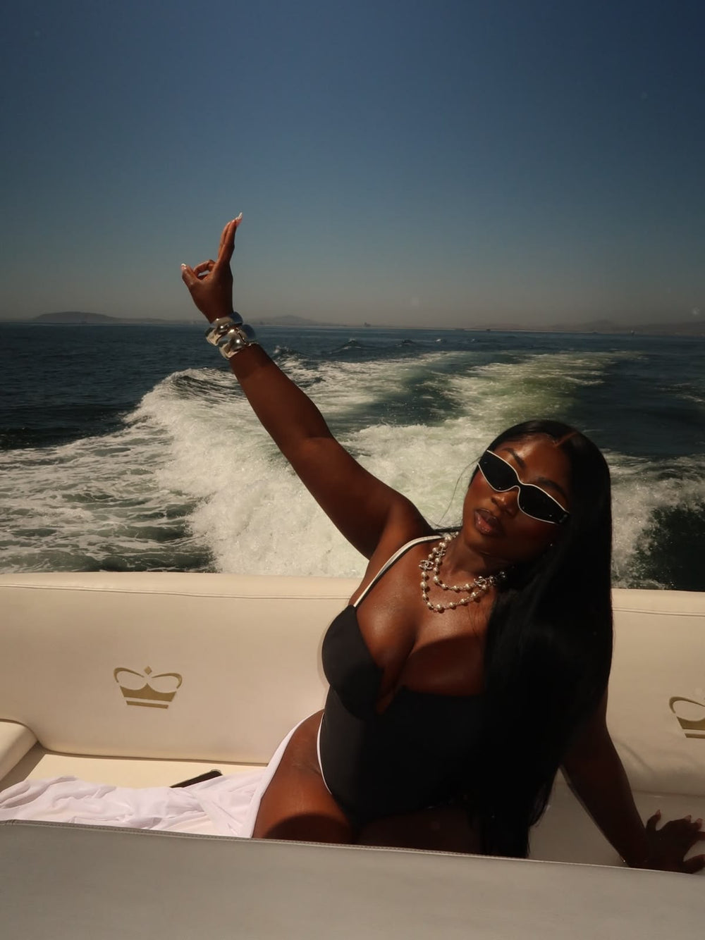 Woman on vacation with waterproof wig install — sweat-proof lace glue by The DayB Experience